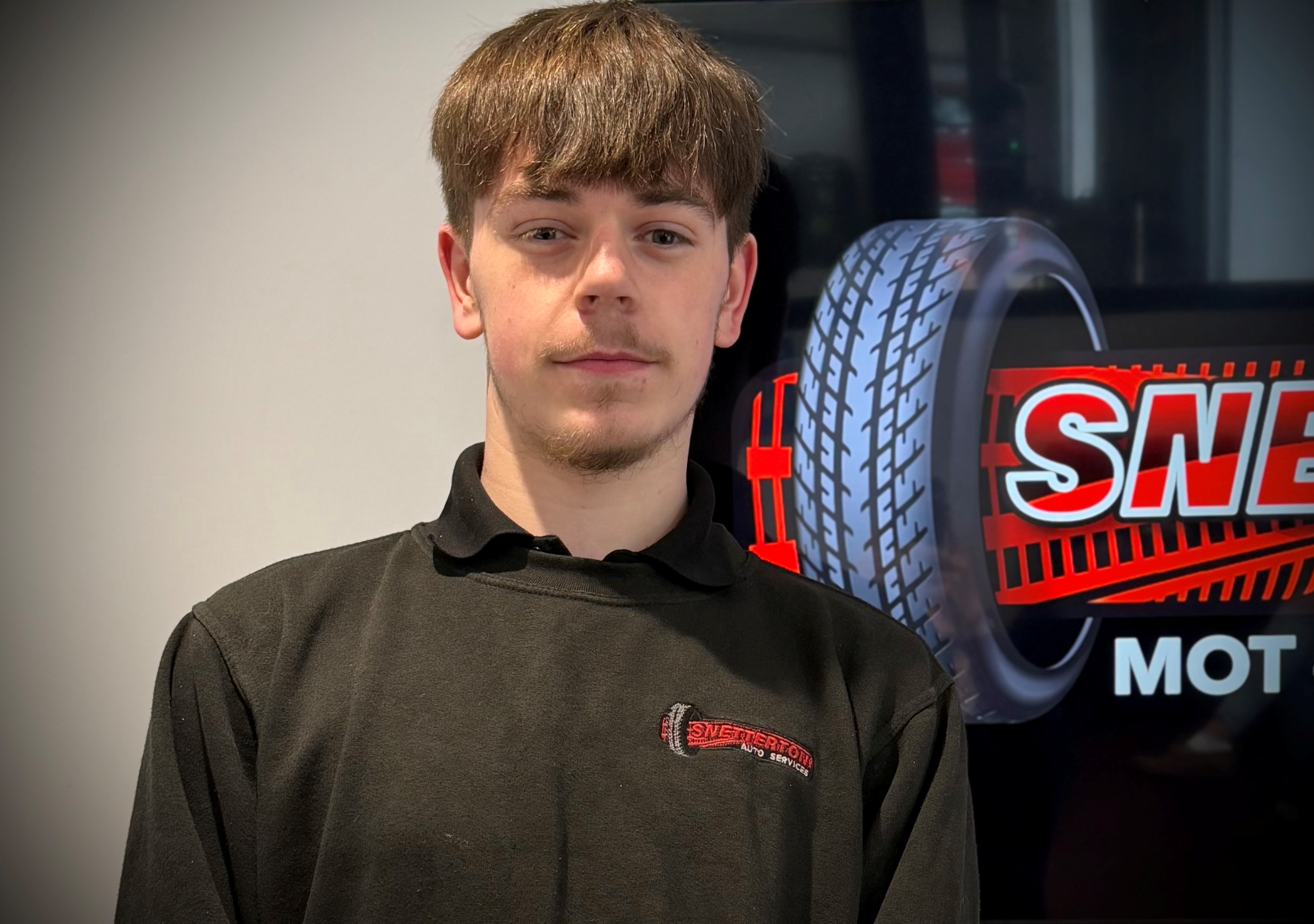 Reece wearing company jacket